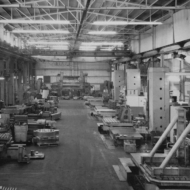 The shop had a professional photographer take pictures for an advertising brochure. This is the main hall. I'm the moving figure circled at the left. I worked on at least a hundred of the big valve bodies shown in front of the machine. Allied Engineering ~ marked